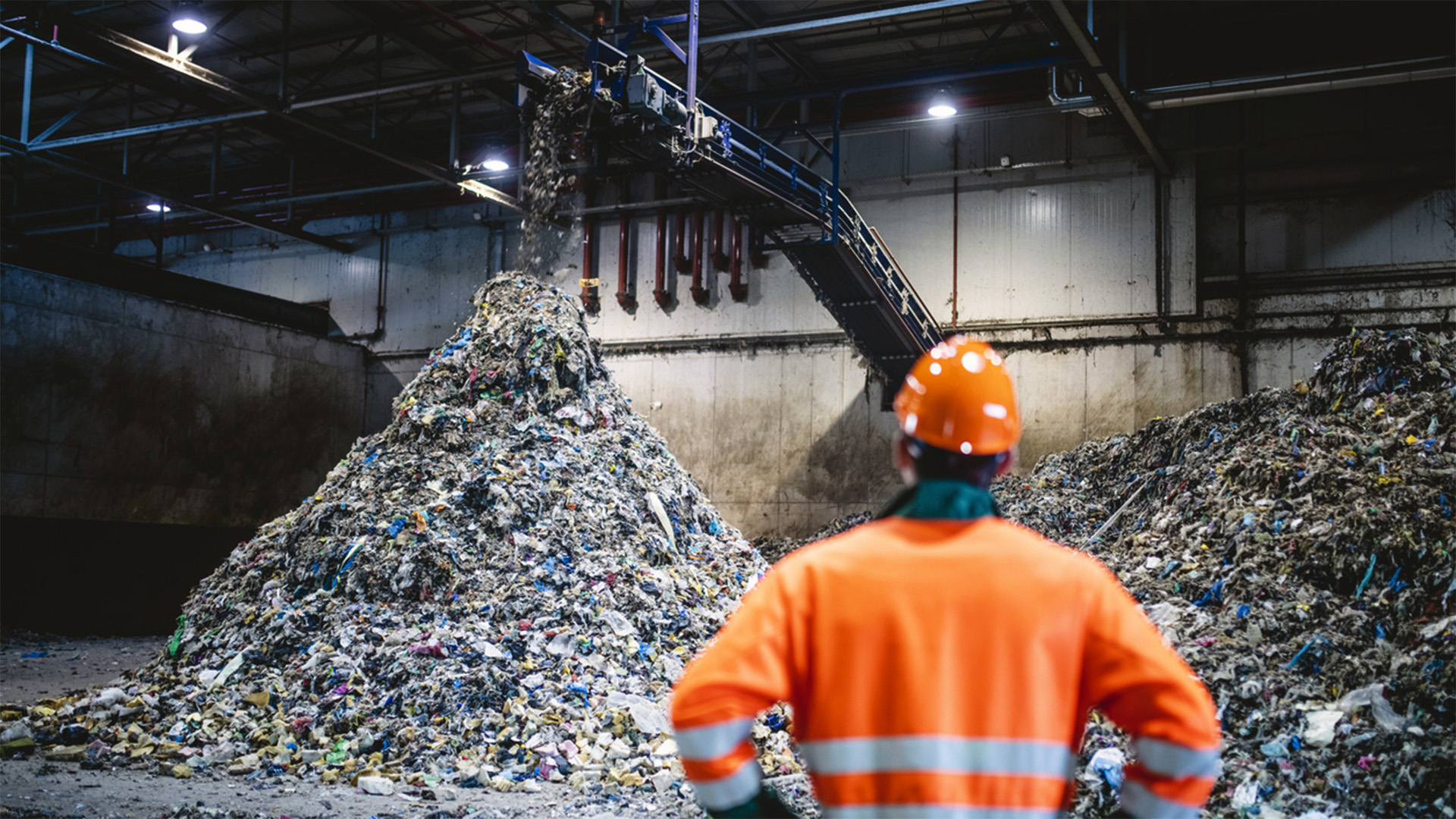 Waste Industry employee standing in warehouse