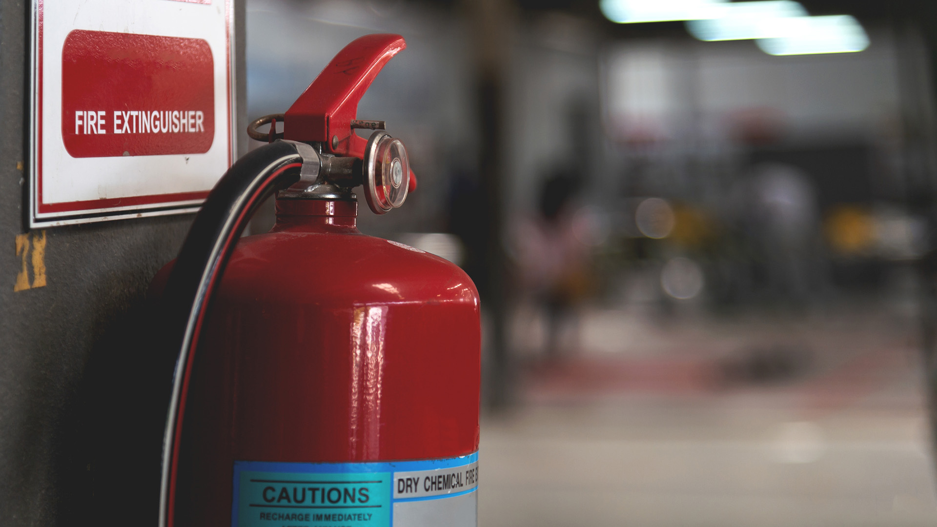 Fire extinguisher hanging on wall