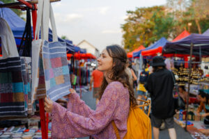 Woman exploring a pop-up street market.