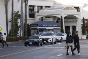 An Orange County security surveillance camera is positioned to view an entrance of the South Coast Plaza shopping mall. Implementing smart security cameras is a proactive strategy for stopping shoplifting and exposing larger theft rings.