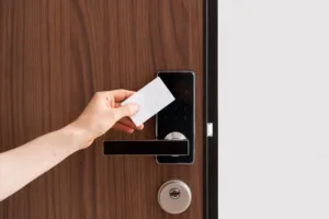 Cropped shot of woman hand hold a key card to access a locked door.
