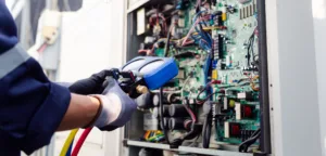 Construction site worker configuring open electrical system.